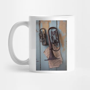 Two Old Rustic Horns Hanging On Door Mug